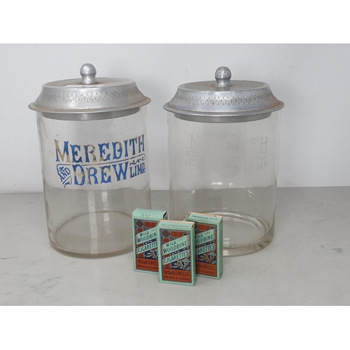 9 - Two Meredith & Drew Biscuits glass Biscuit Barrels with metal lids 9 1/2in H and three empty 'Will's... 