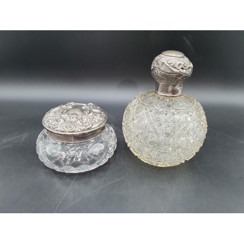 93 - An Edward VII silver lidded cut glass Scent Bottle, Birmingham 1906, A/F, and a silver lidded glass ... 