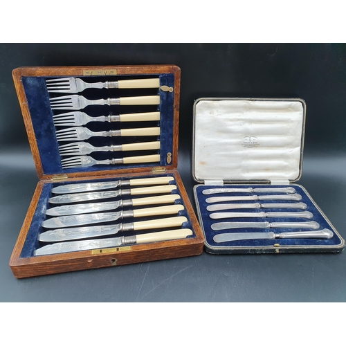 95 - Six silver hafted Cake Knives and six Fish Knives and Forks, both cased
