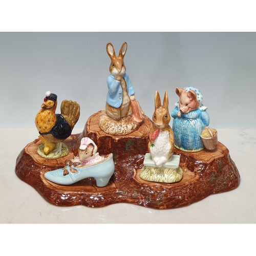 247 - A collection of Nine Beswick Beatrix Potter Figures and a Figurine Display Stand including, 