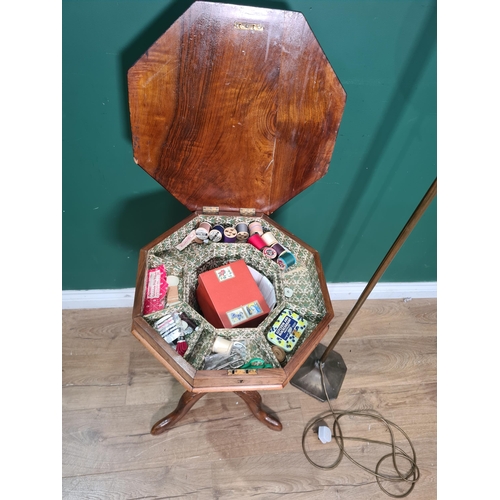 835 - A late Victorian walnut octagonal Games/Work Table, tapering to the tripod base, 2ft 4in H and a bra... 