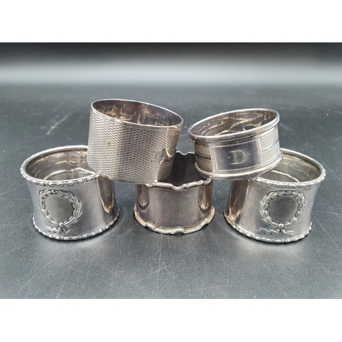117 - Five various silver Napkin Rings including a pair, Birmingham 1910