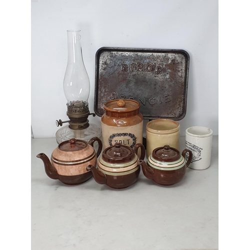 13 - A glass Oil Lamp, a 'Bird's Sponge' Baking Tray, three graduated brown glazed Tea Pots, a stoneware ... 