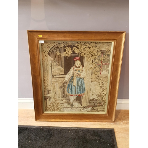 224 - A Victorian Tapestry of a young girl stood in a doorway playing with a cat, 2ft 1in x 1ft 10in, (R8)