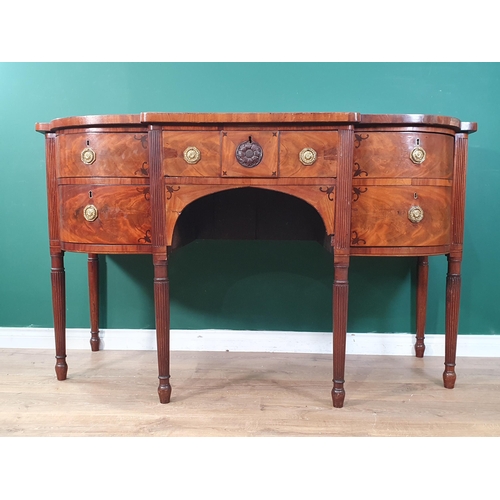 25 - A 19th Century mahogany breakfront Sideboard with ebony stringing fitted three drawers and a cupboar... 