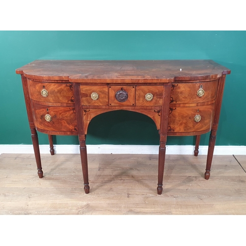 25 - A 19th Century mahogany breakfront Sideboard with ebony stringing fitted three drawers and a cupboar... 