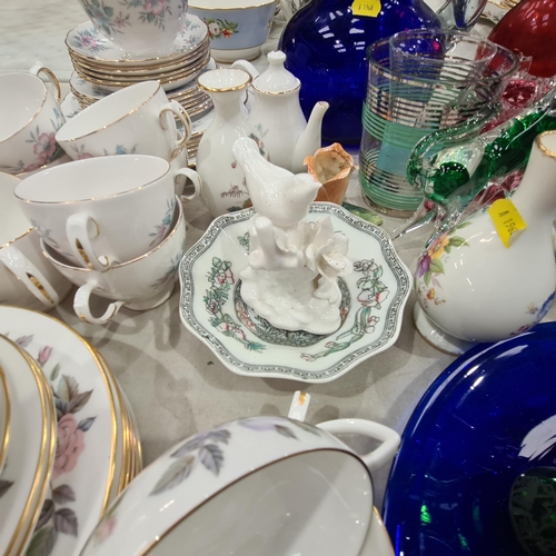 325 - A selection of teaware, a blue glass Jug, a red glass Vase with flared rim, a blue glass Plate and o... 