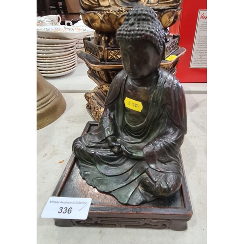 336 - A hollow bronzed Figure of a seated Buddha on carved hardwood base, a carved gilded Figure of seated... 