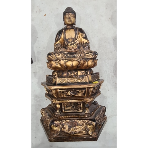 336 - A hollow bronzed Figure of a seated Buddha on carved hardwood base, a carved gilded Figure of seated... 