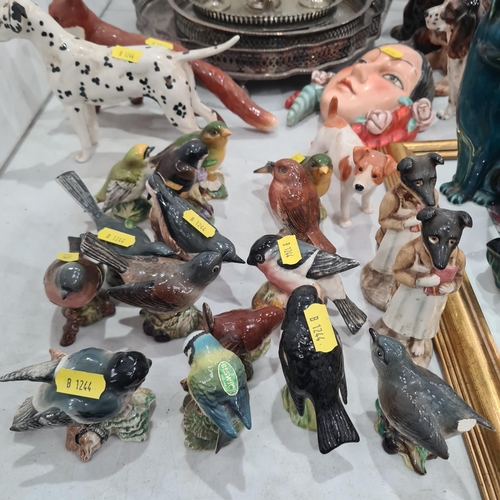 370 - A collection of ceramic ornaments and figurines including, Beswick Fox, Beswick Arnoldene Dalmation,... 