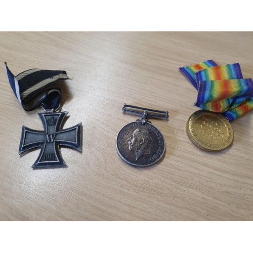 89 - A Iron Cross Medal and two 1st World War Medals