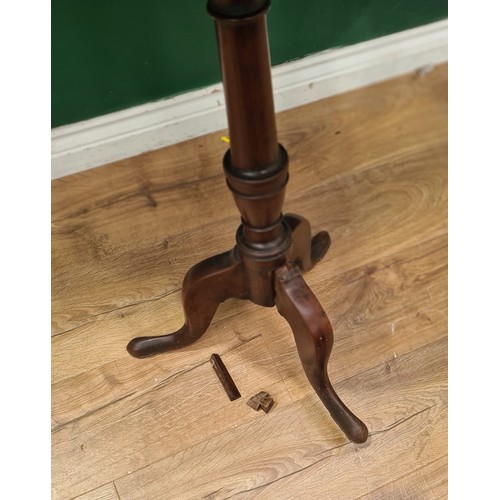 130A - A 19th Century mahogany tilt-top Table on turned column and tripod base, 2ft 1in Diam, A/F