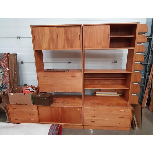 284 - A mid-Century sectional Wall Unit fitted drawers and sliding doors and with later pigeonholes attach... 