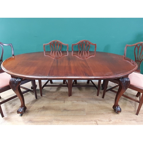 485 - A Victorian mahogany oval extending Dining Table with spare leaf and winder, raised on carved cabrio... 