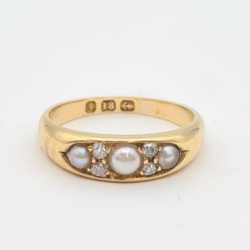 156 - A Cultured Pearl and Diamond Ring pavé-set three graduated half pearls with pairs of old-cut diamond... 