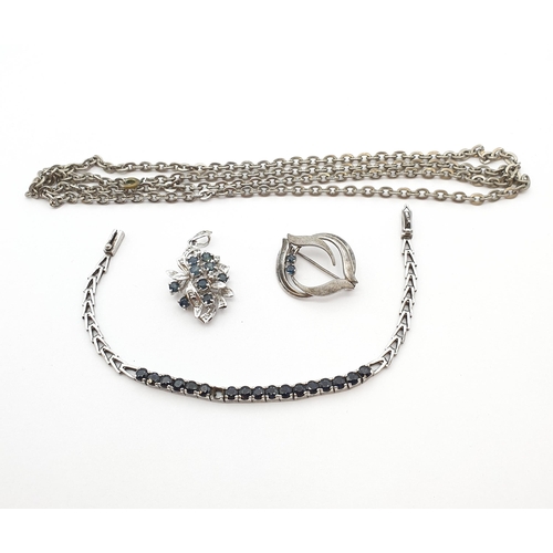 173 - A silver line Bracelet set round sapphires, one stone deficient, a white metal Chain, a silver brooc... 