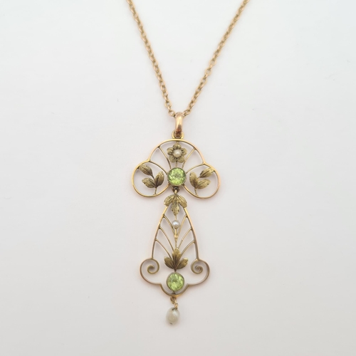 177 - An Art Nouveau Peridot and Seed Pearl Pendant millegrain-set two round peridot and two seed pearls t... 