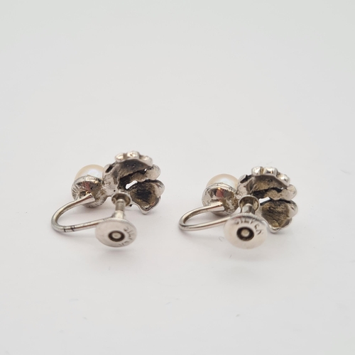 180 - A pair of Cultured Pearl and Marcasite Earrings in silver, on screw fittings