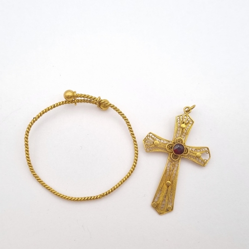 191 - A yellow metal filigree Cross set garnet and a yellow metal child's Christening Bracelet, possibly C... 