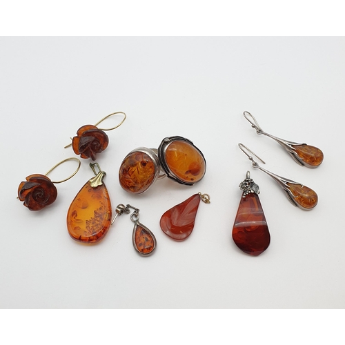 198 - Modern Amber Jewellery including; two Rings, two pairs of Earrings and several Pendants