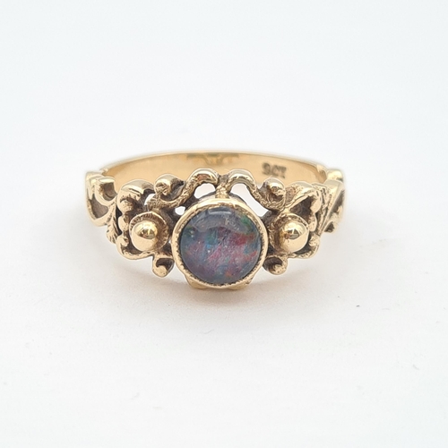 210 - An Opal triplet Ring set round cabochon to intricate mount, stamped 9ct, ring size N 1/2, approx 3.5... 