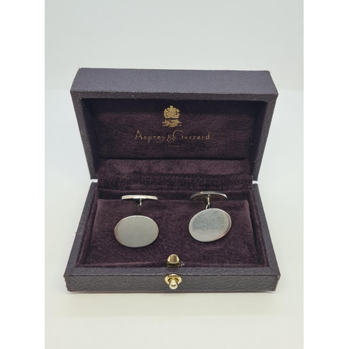 217 - A Pair of Asprey & Garrard oval silver Cufflinks, boxed