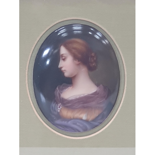 390 - A Berlin porcelain oval Plaque, painted female bust portrait, 3 1/2in