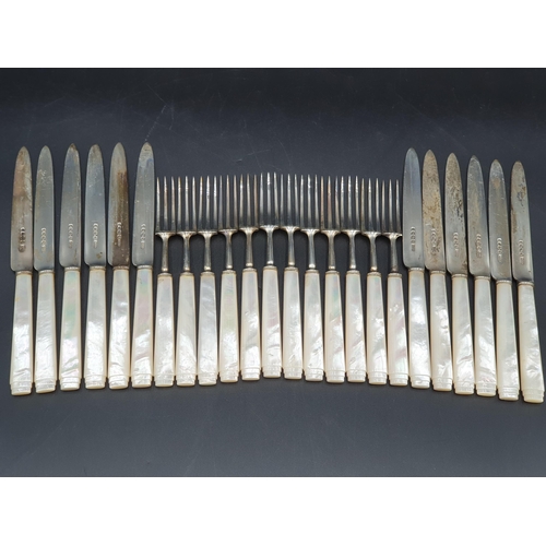 102 - One dozen George V Dessert Knives and Forks with silver blades and mother of pearl hafts, Sheffield ... 