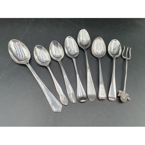 103 - Seven various silver Spoons and a Fork with flower finial