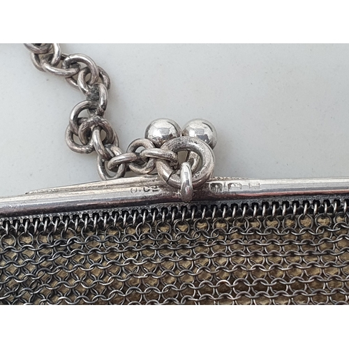 104 - A George V silver small Mesh Purse, Birmingham 1923, and another, larger, the clasp set blue cabocho... 