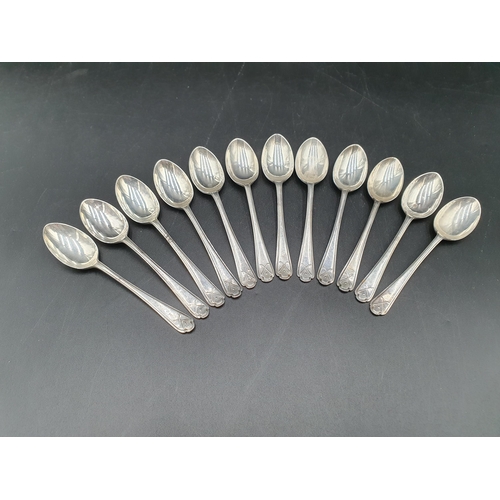 107 - One dozen George V silver Golfing Spoons, Sheffield 1933