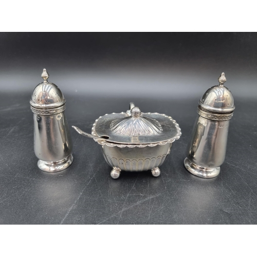 112 - A Victorian silver Mustard Pot on ball feet, Sheffield 1890, with Spoon, Chester 1898, and a pair of... 