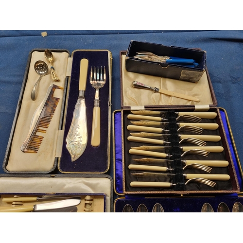 115 - A set of one dozen plated Teaspoons and Sugar Tongs, pair of Fish Servers, Fish eaters, pair of Serv... 