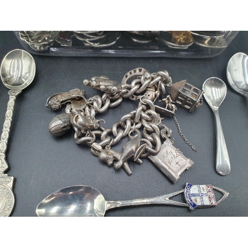 126 - A silver \charm Bracelet with numerous charms, a silver salt Spoon, and a quantity of Continental si... 