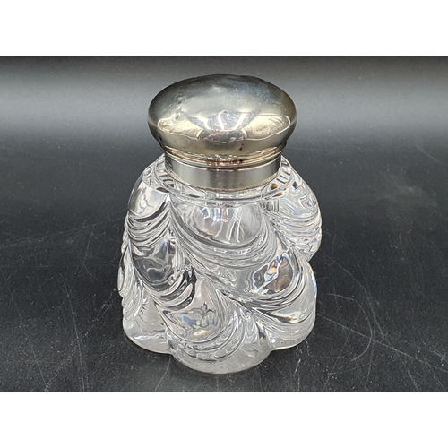 128 - A Victorian silver lidded glass Inkwell spirally moulded, London 1893