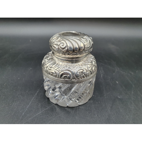 132 - A Victorian silver mounted and lidded glass Inkwell with gadroon and scroll embossing, Birmingham 18... 