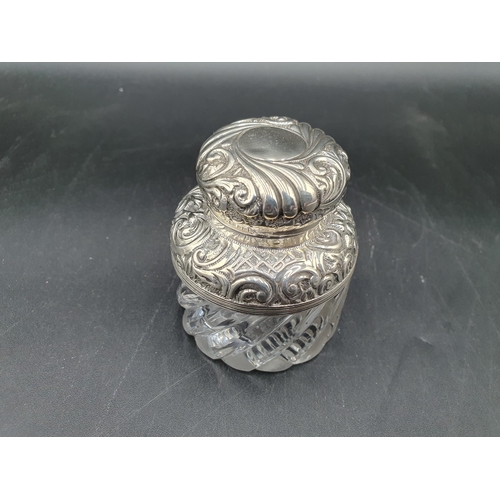 132 - A Victorian silver mounted and lidded glass Inkwell with gadroon and scroll embossing, Birmingham 18... 