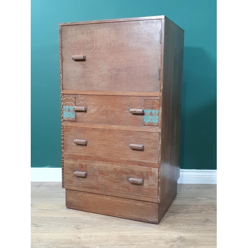 14 - A 1920's Art Deco oak Tallboy, (Fitted Cupboard above three drawers, with floral decorations. 3ft 4i... 