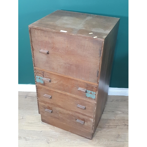 14 - A 1920's Art Deco oak Tallboy, (Fitted Cupboard above three drawers, with floral decorations. 3ft 4i... 