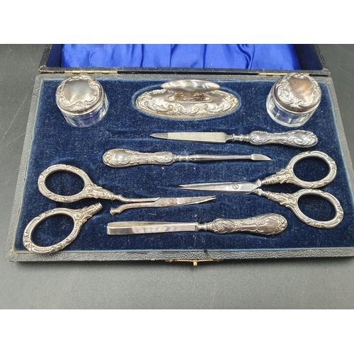 145 - A George V silver mounted eight piece Manicure Set, Birmingham 1912, in case, one item A/F