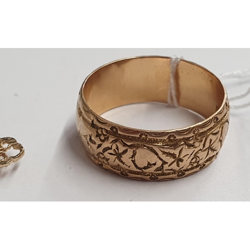 170 - An 18ct gold embossed Wedding Band, ring size P/Q, approx 5.60gms and a small filigree Cross set rou... 