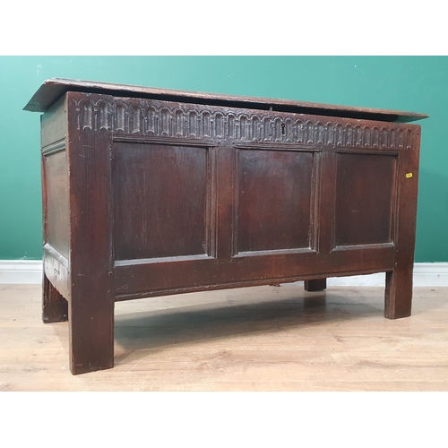 23 - A 17th Century oak Coffer with hinged top above a gauge carve frieze and three panels, 3ft 9in W x 2... 