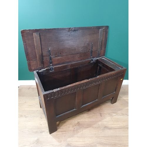 23 - A 17th Century oak Coffer with hinged top above a gauge carve frieze and three panels, 3ft 9in W x 2... 