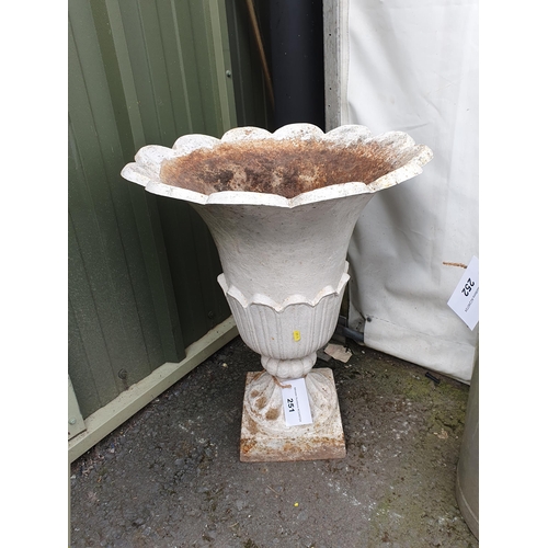 251 - A white painted cast iron Garden Urn with flared petal design on pedestal base, 2ft 5