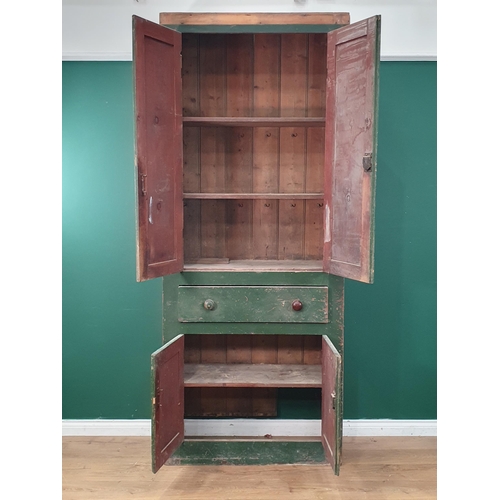 27 - A 19th Century green painted Welsh Food/Larder Cupboard, having a pair of panelled doors enclosing s... 