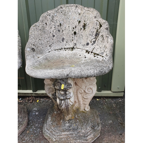 279 - A pair of composite stone Grotto Seats with shaped backrests raised on stylised Lion supports and he... 