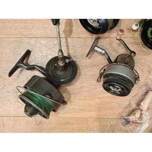 3 - A Luxor fixed spool beach casting Reel, four Super 87 fixed spool beach casting Reels, a closed face... 