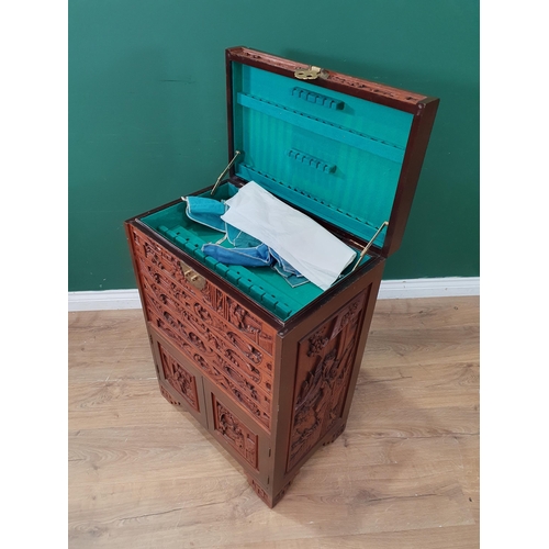 31 - A Chinese carved hardwood Cutlery Stand with hinged top and with fitted drawers and pair of cupboard... 