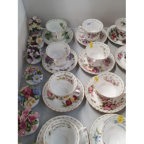 310 - Twelve Royal Albert Flower of the Month series Cups and and Saucers and a collection of Royal Albert... 