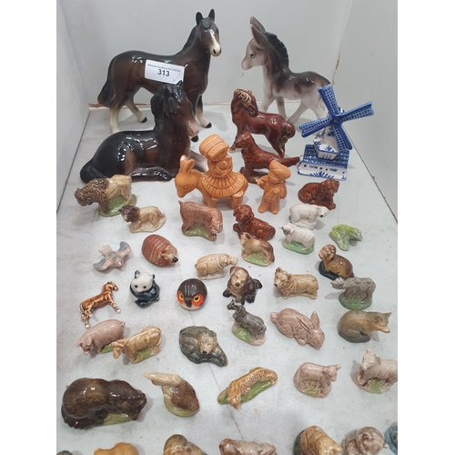 313 - A collection of Wade Whimsies, two Horse Figures, a Donkey, etc. (R5).